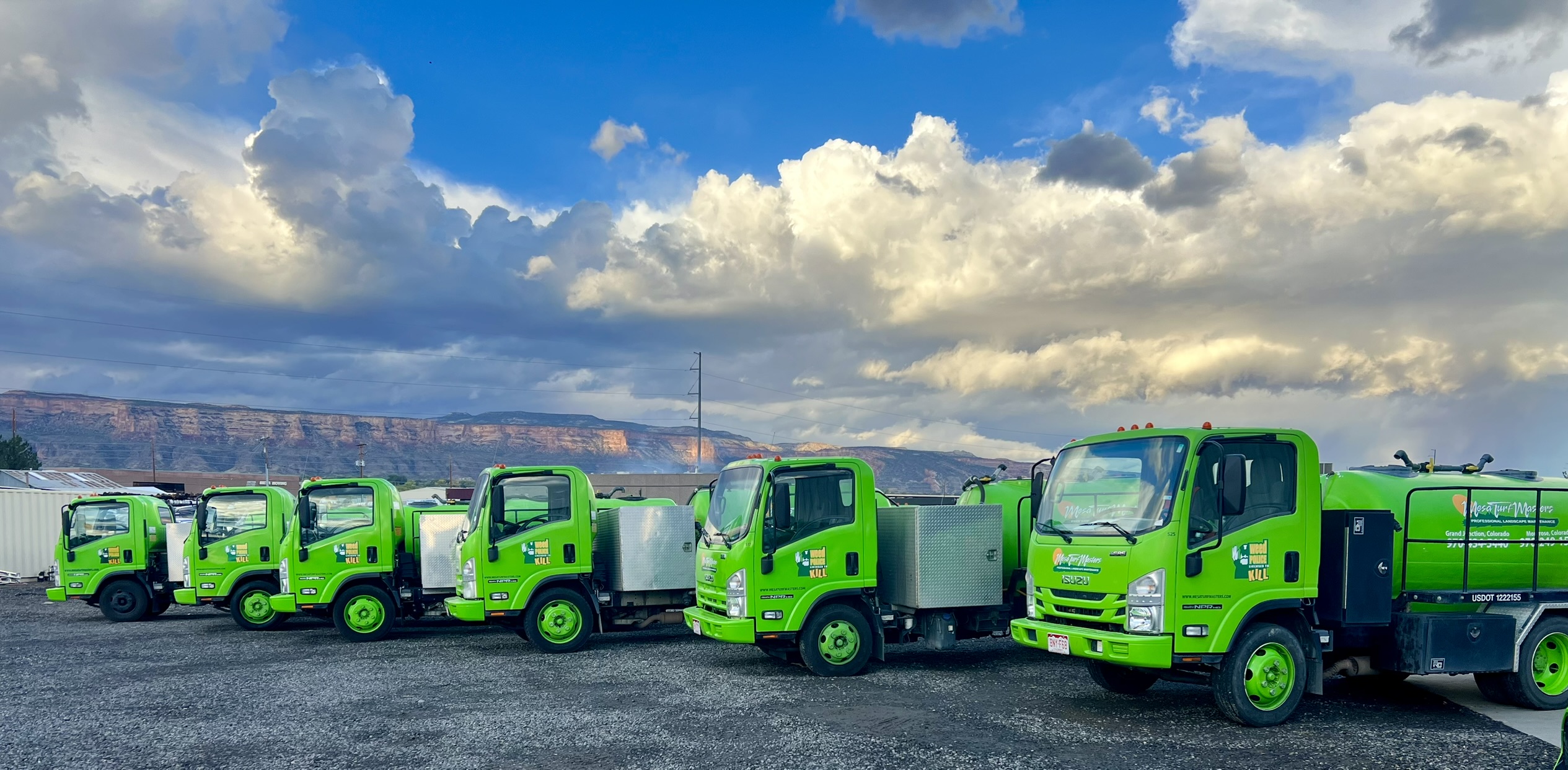 Mesa Turf Masters fleet of green trucks